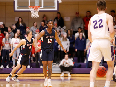 Photo of Kareem Anthony-Bello getting ready to play defense in a game against St. Thomas.