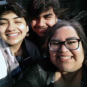 This is a photo of Carla Guillen with her brother, Juan-Pablo, and her sister, Daniela, who works on the Twin Cities Campus as an administrative assistant.