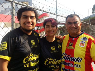 This is a photo of Carla Guillen and her brother and father at a soccer game in Mexico.
