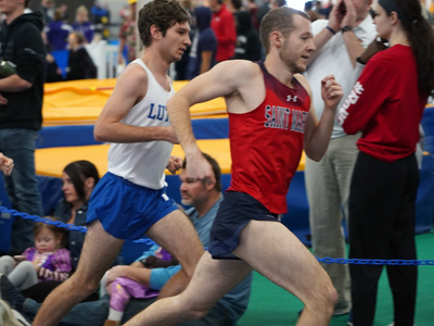This is a photo of Jacob Tschida competing on the men's track team.