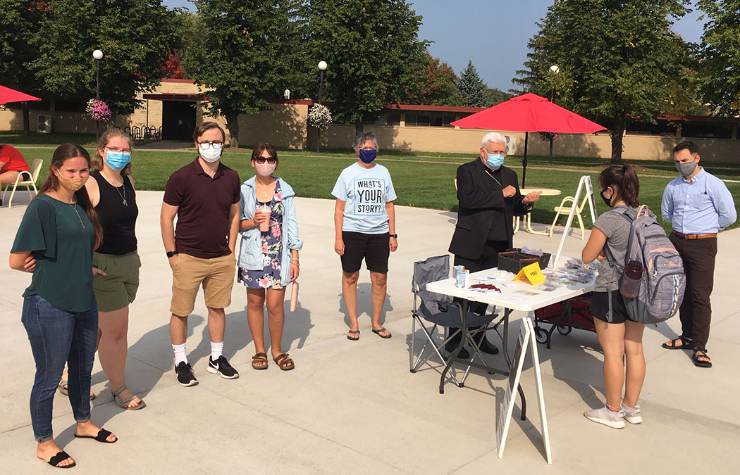 Bishop Quinn joins students for prayer station